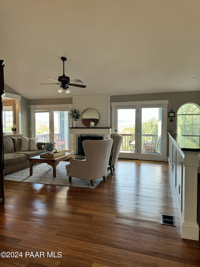 living room with hardwood / wood-style flooring and ceiling fan