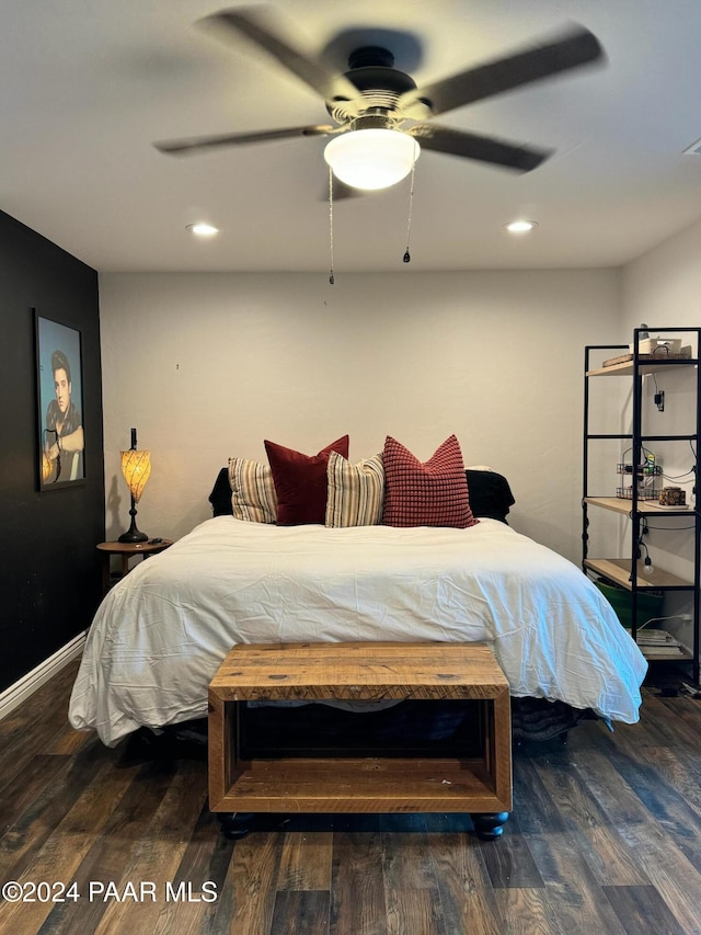 bedroom with ceiling fan and dark hardwood / wood-style flooring