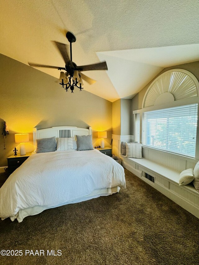 bedroom with dark hardwood / wood-style flooring and ceiling fan