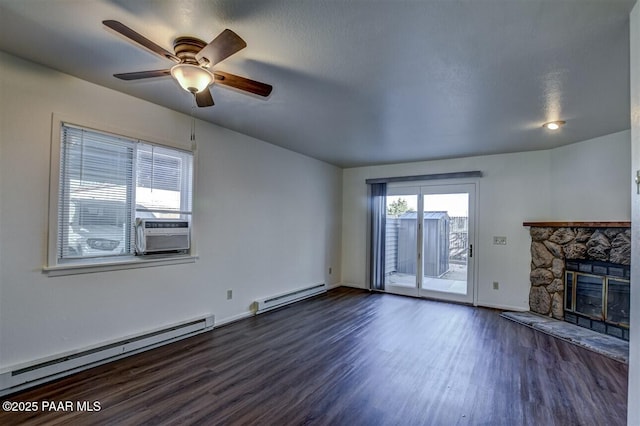 1242 Stetson Rd Unit 21, Prescott, AZ 86303 - unfurnished living room with baseboard heating, dark wood-type flooring, cooling unit, and a fireplace