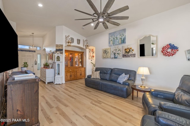 living area featuring recessed lighting, light wood-type flooring, ceiling fan, and vaulted ceiling