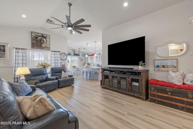 living area featuring wood finished floors, visible vents, lofted ceiling, recessed lighting, and ceiling fan