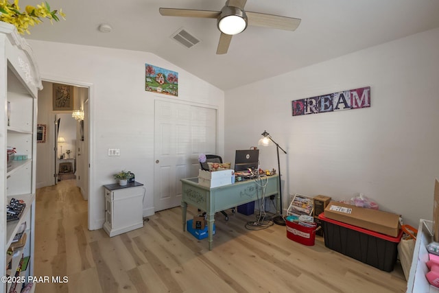 office space with visible vents, lofted ceiling, ceiling fan, and light wood finished floors