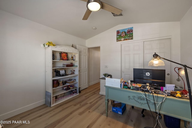 office space with baseboards, wood finished floors, ceiling fan, and vaulted ceiling