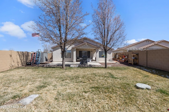 view of yard with a patio and a fenced backyard