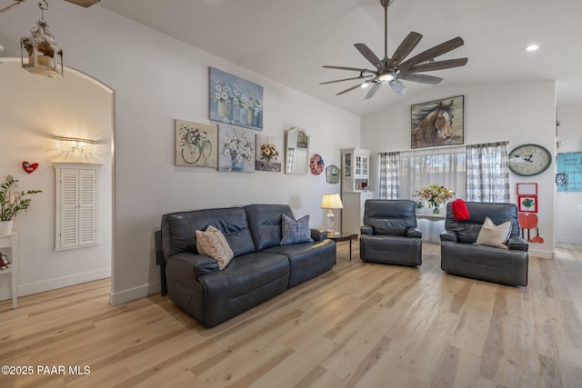 living room with vaulted ceiling, a ceiling fan, baseboards, and wood finished floors