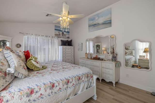 bedroom with ceiling fan, multiple windows, visible vents, and light wood-type flooring