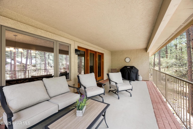 exterior space with a balcony and an outdoor hangout area