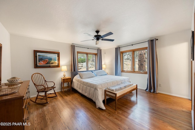 bedroom with baseboards and light wood-style flooring