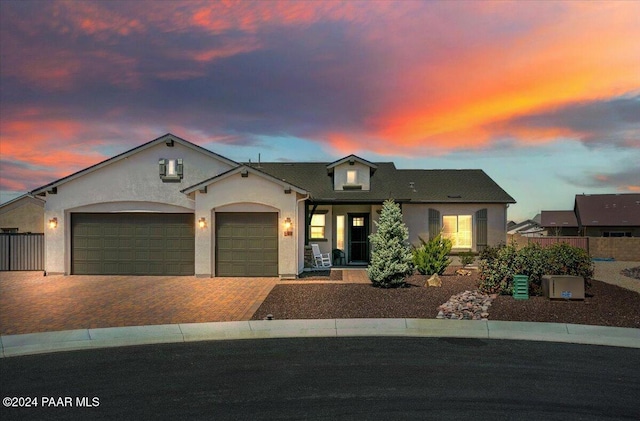 view of front of property with a garage