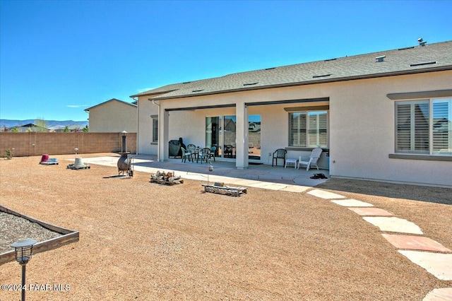 rear view of house featuring a patio