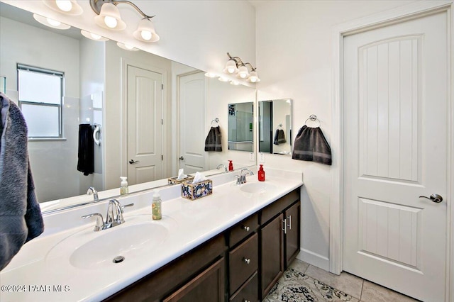 bathroom featuring tile patterned flooring and vanity