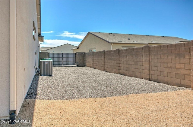 view of yard with central AC