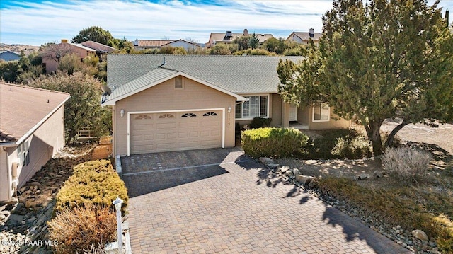 ranch-style house featuring a garage