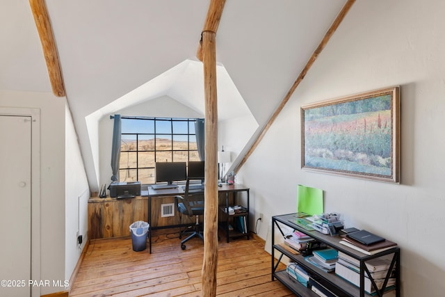 office featuring light wood-type flooring and lofted ceiling