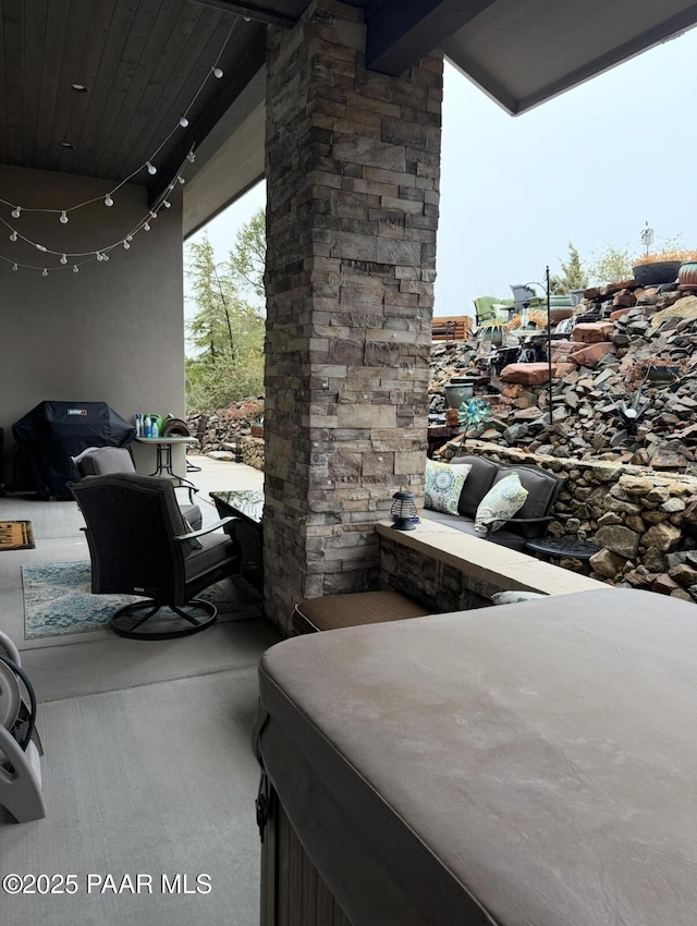 view of patio / terrace featuring a hot tub