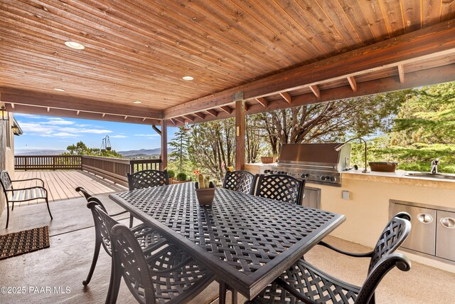 1515 N Happy Valley Rd Unit 3 & 4, Prescott, AZ 86305 - view of patio featuring outdoor dining space, exterior kitchen, and a deck with mountain view