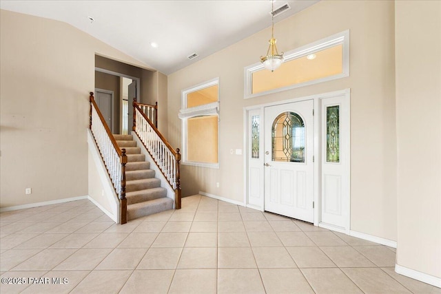 13375 N Iron Hawk Dr, Prescott, AZ 86305 - entrance foyer with stairway, visible vents, vaulted ceiling, and light tile patterned flooring