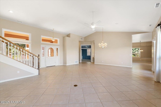 13375 N Iron Hawk Dr, Prescott, AZ 86305 - unfurnished living room featuring light tile patterned floors, ceiling fan with notable chandelier, lofted ceiling, and baseboards
