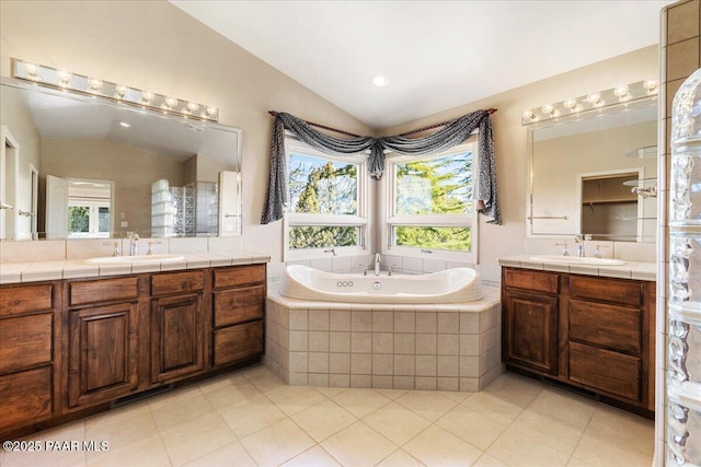 13375 N Iron Hawk Dr, Prescott, AZ 86305 - bathroom with two vanities, lofted ceiling, a garden tub, and a sink