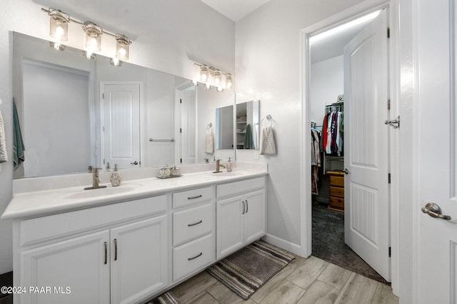 bathroom with wood-type flooring and vanity