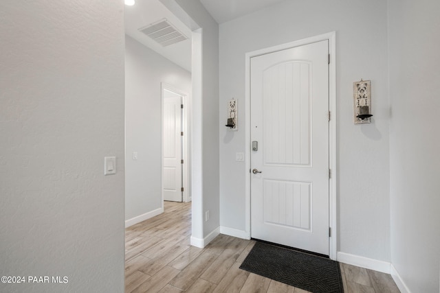 foyer with light hardwood / wood-style flooring