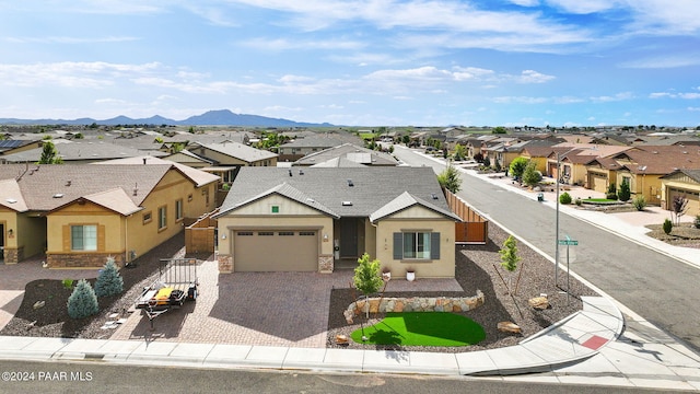 ranch-style house featuring a mountain view and a garage