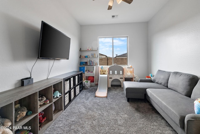 living room featuring carpet and ceiling fan