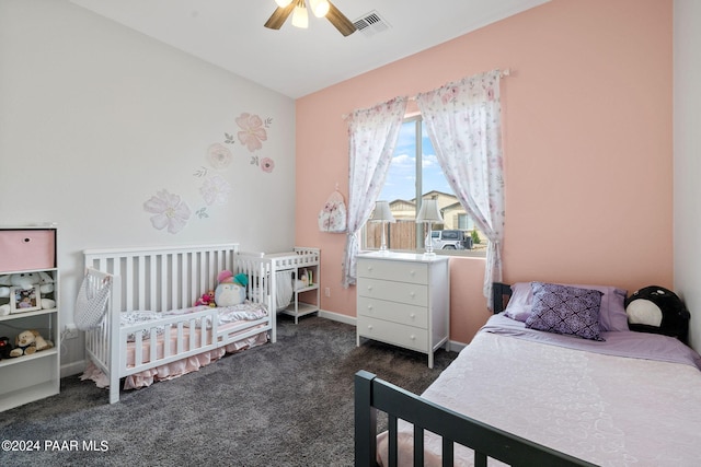 bedroom with ceiling fan and dark colored carpet