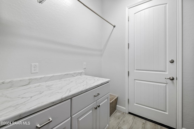 bathroom featuring hardwood / wood-style flooring and vanity