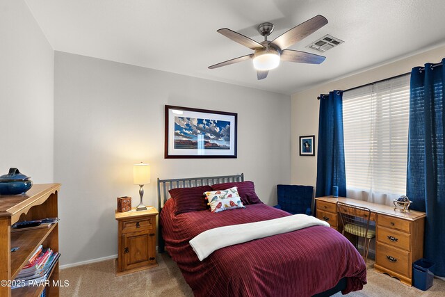 1819 W Deer Creek Rd, Phoenix, AZ 85045 - bedroom with light colored carpet, baseboards, and ceiling fan