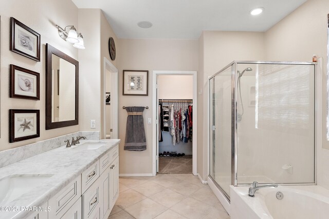 1819 W Deer Creek Rd, Phoenix, AZ 85045 - full bathroom featuring a stall shower, double vanity, tile patterned floors, and a bath