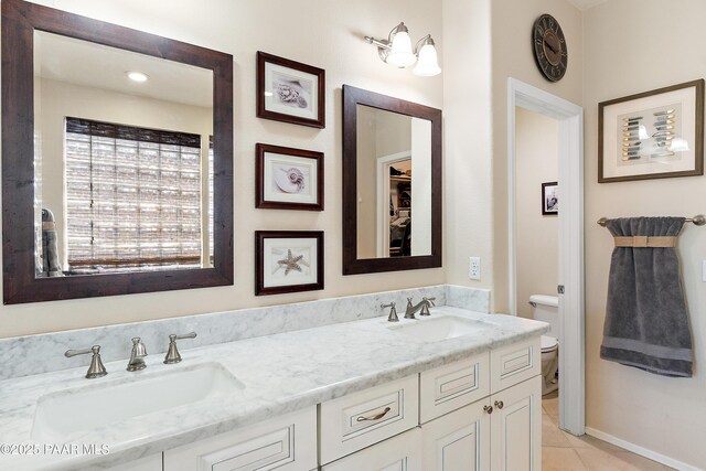 1819 W Deer Creek Rd, Phoenix, AZ 85045 - bathroom with toilet, double vanity, and tile patterned floors