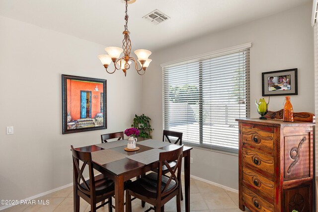 1819 W Deer Creek Rd, Phoenix, AZ 85045 - dining room featuring a chandelier, light tile patterned floors, and baseboards