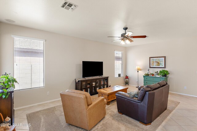 1819 W Deer Creek Rd, Phoenix, AZ 85045 - living room featuring light tile patterned floors, a ceiling fan, and baseboards