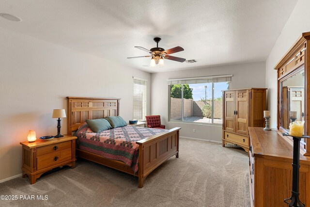 1819 W Deer Creek Rd, Phoenix, AZ 85045 - bedroom featuring light carpet, baseboards, and a ceiling fan