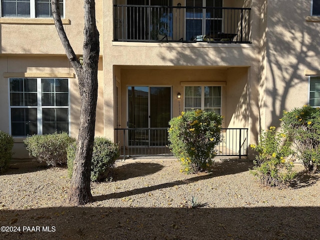 property entrance with a balcony