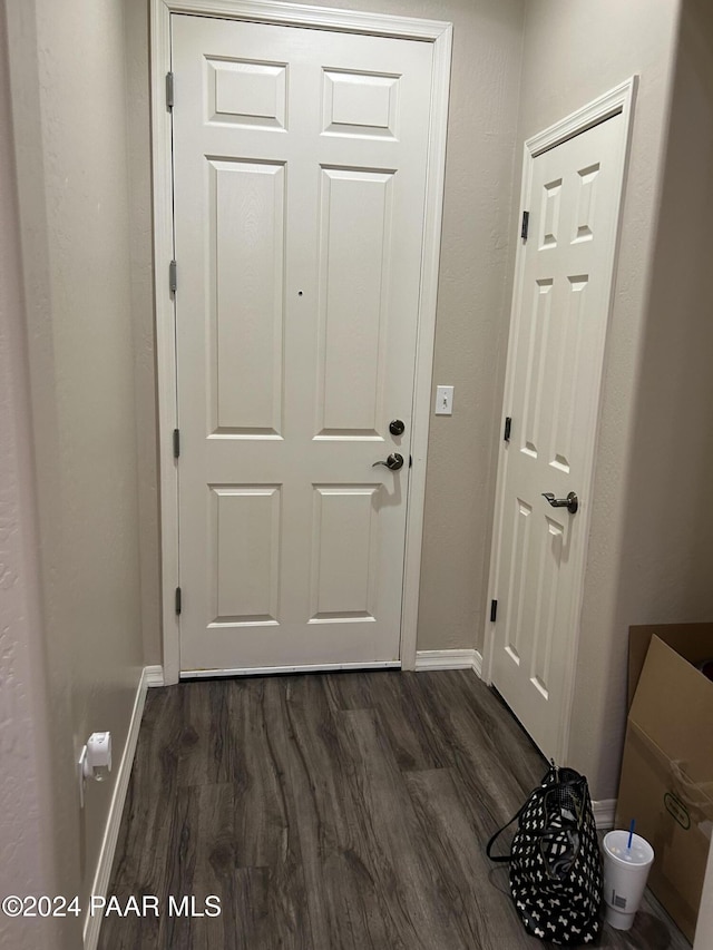 doorway to outside with dark hardwood / wood-style flooring