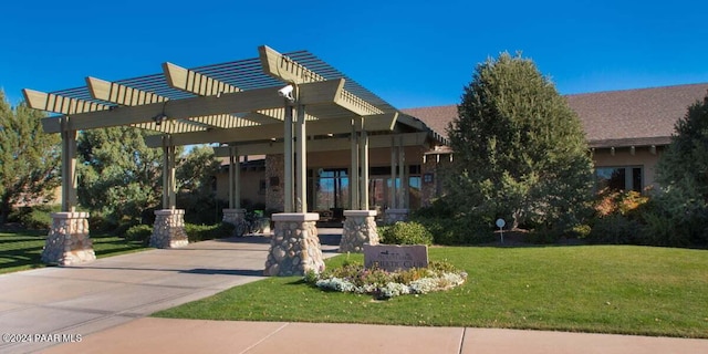 exterior space featuring a pergola and a yard