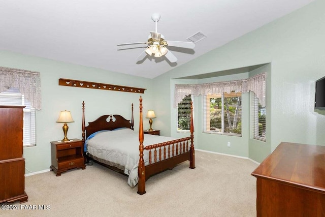 bedroom featuring ceiling fan, light colored carpet, and lofted ceiling