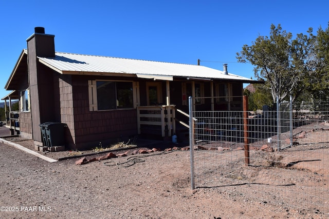 25633 W El Dorado Dr, Seligman, AZ 86337 - single story home with an outdoor structure, metal roof, an exterior structure, and a chimney