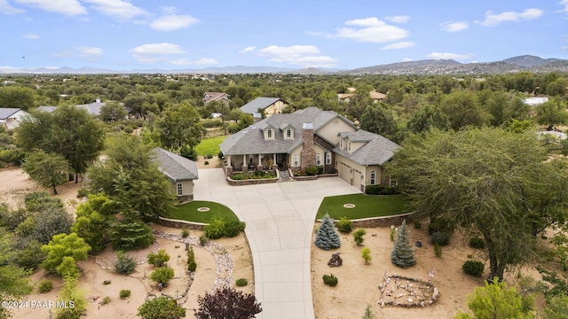 birds eye view of property featuring a mountain view