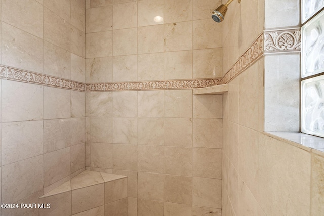 bathroom with a tile shower