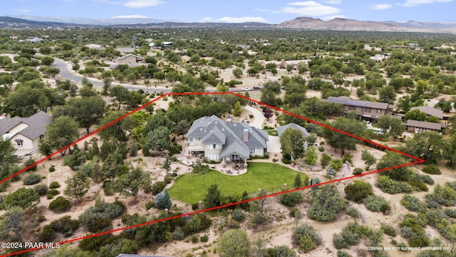 birds eye view of property with a mountain view