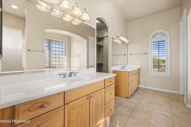 bathroom featuring tile patterned flooring and vanity