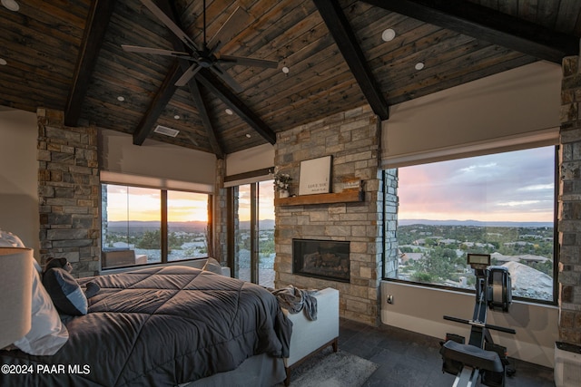 bedroom with beam ceiling, a fireplace, high vaulted ceiling, and wooden ceiling