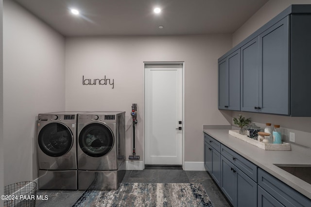 laundry room with cabinets and separate washer and dryer