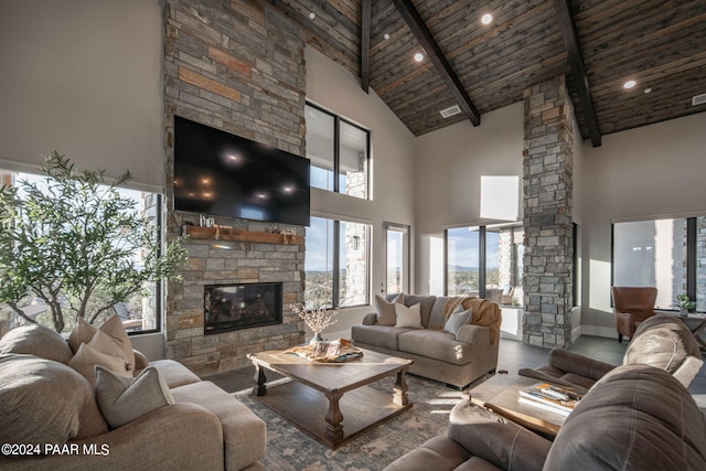 5535 W Corliss Cir, Prescott, AZ 86305 - living area with high vaulted ceiling, a fireplace, wood ceiling with exposed beams, healthy amount of natural light, and decorative columns