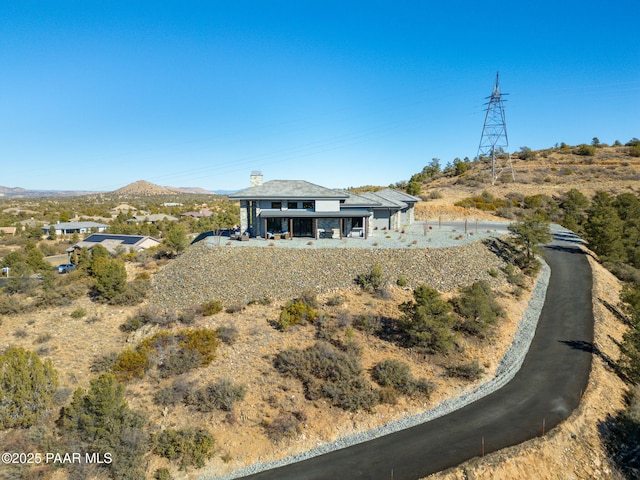 5535 W Corliss Cir, Prescott, AZ 86305 - back of house featuring a mountain view and a chimney