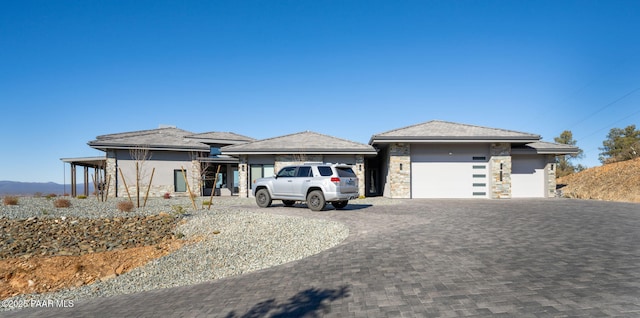 5535 W Corliss Cir, Prescott, AZ 86305 - prairie-style house with decorative driveway, an attached garage, and stone siding